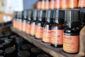 a shelf with organic and non-organic essential oils